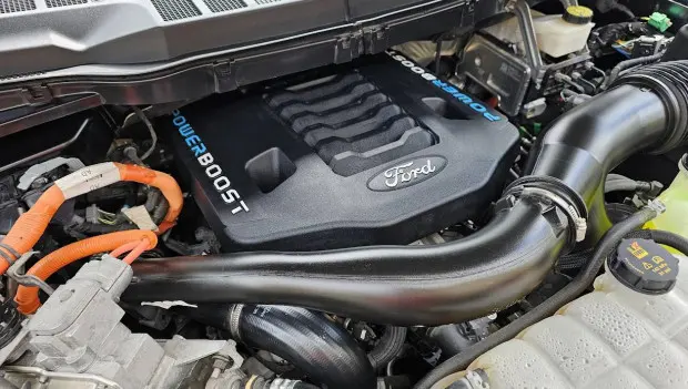 Why Modern Engines Hide Under Plastic — and What That Cover Really Does