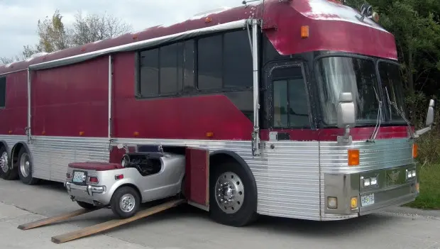 Enthusiasts Turn an Old Bus Into a Motorhome With a Built-In Car Garage