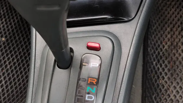 Many Americans Don’t Know This: What’s That Red Button Next to the Shifter For?