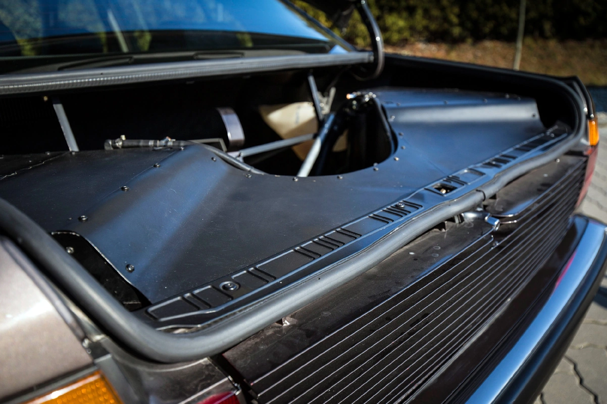 The entire cooling system had to be redesigned, and the massive radiators and fans... relocated to the rear of the car