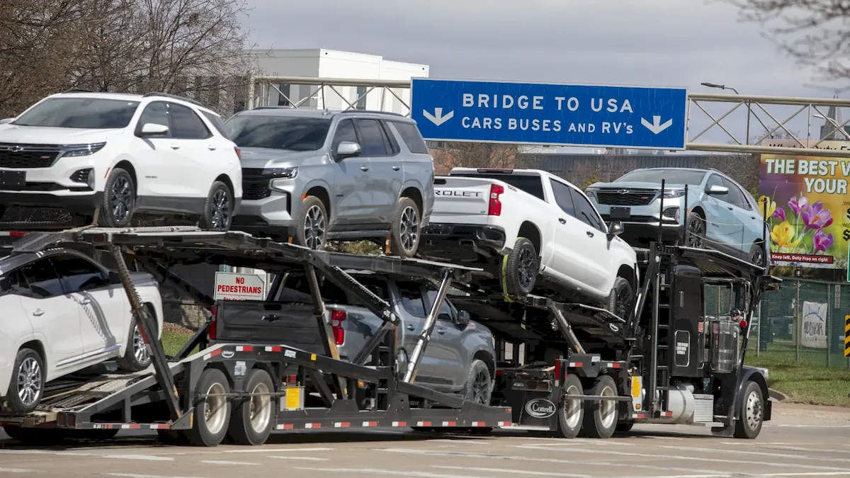 Trucks make their way to the Ambassador Bridge to cross into the United States at Detroit on April 1, 2025 in Windsor, Canada. 